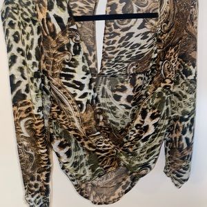 Deep cut, animal print blouse